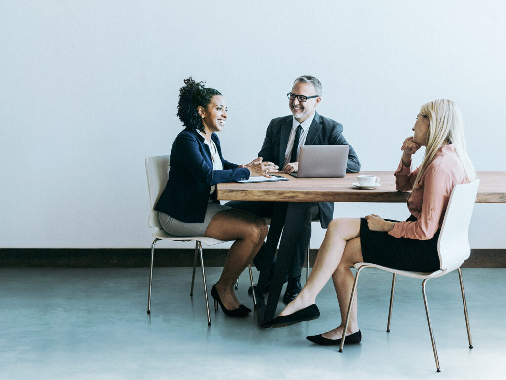 Three people working together